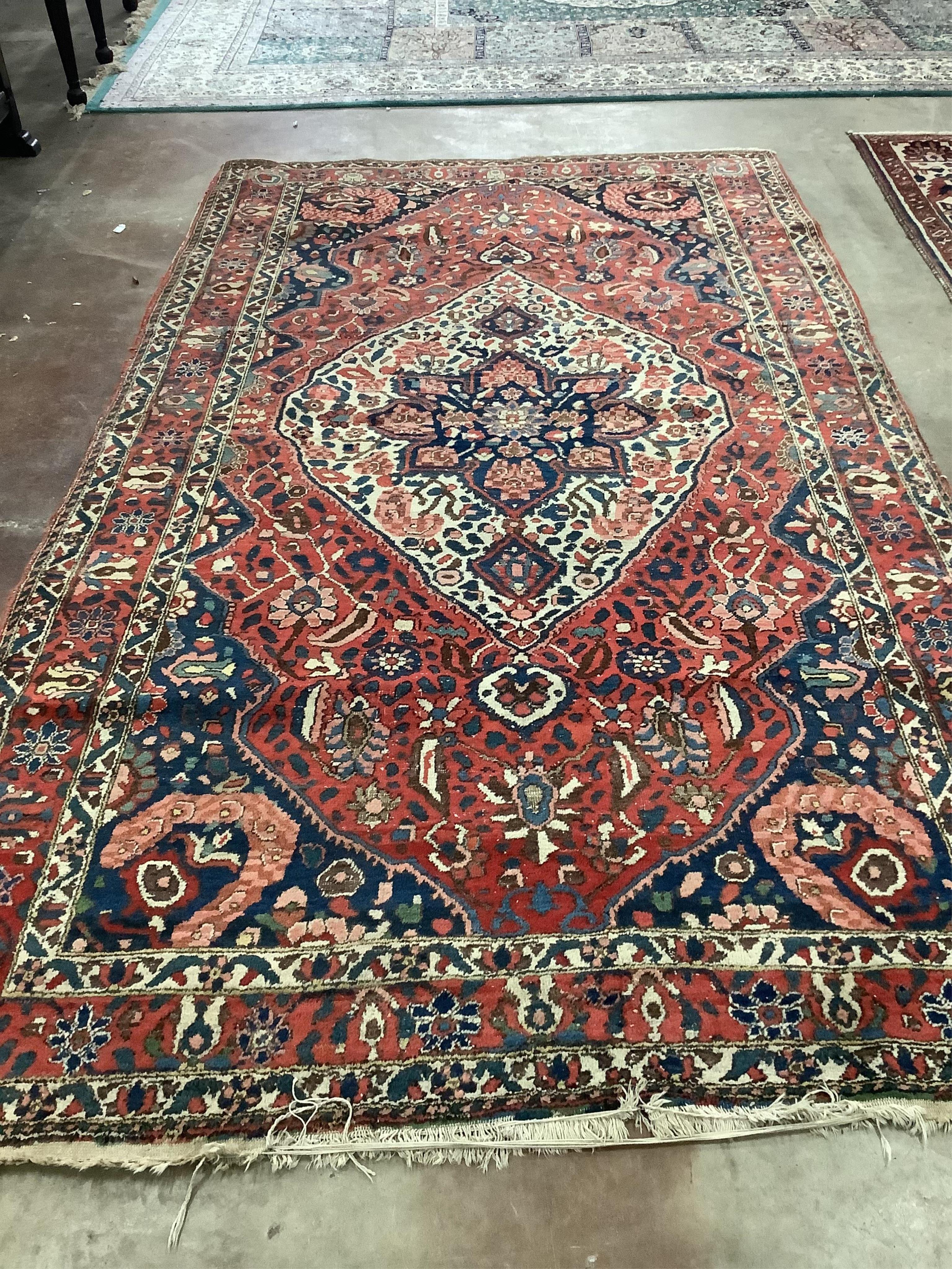 A North West Persian brick red ground carpet, 320 x 178cm. Condition - poor to fair